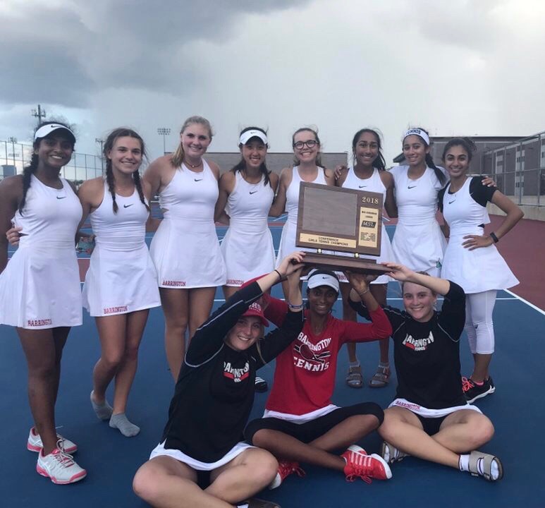 The+varsity+girls+tennis+team+poses+with+their+number+one+conference+trophy.+The+team+tied+with+Fremd+High+School+for+the+title.+%E2%80%9CI%E2%80%99m+really+proud+of+our+team+because+no+one+expected+us+to+win%2C%E2%80%9D+senior+and+team+captain+Kathleen+Tomasian+said.+%E2%80%9CFremd+had+stronger+players+and+a+lot+of+other+coaches+in+our+conference+expected+Barrington+to+be+taken+out.+Towards+the+end+of+the+day%2C+we+were+feeling+pretty+down+because+we+thought+that+Fremd+had+got+it%2C+but+when+coaches+were+counting+points+and+they+realized+it+was+a+tie%2C+we+were+ecstatic%2C+we+were+all+so+happy.%E2%80%9D+Photo+courtesy+of+Tracy+Waters.+