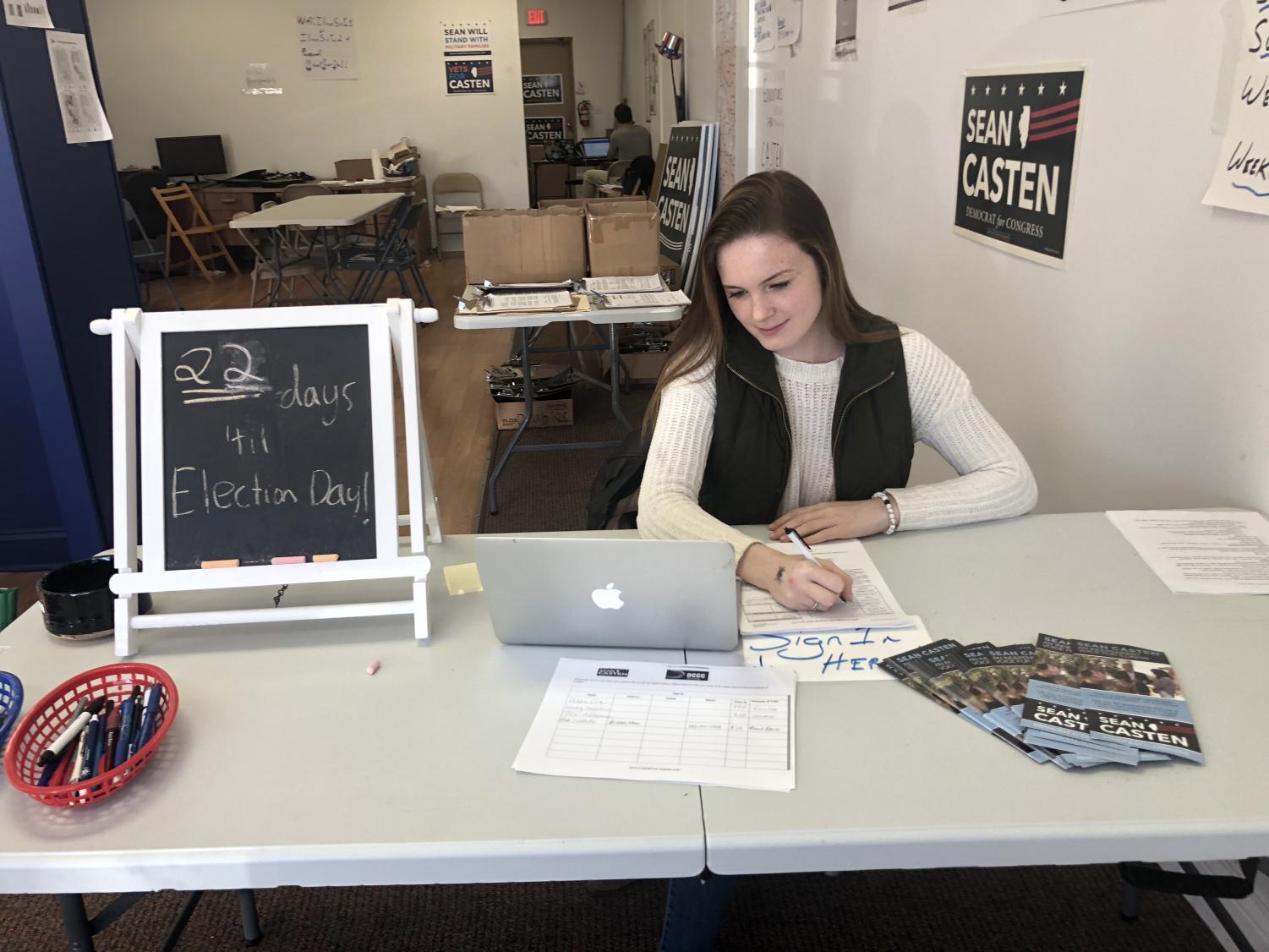 Senior Amanda Dern volunteers at Democratic nominee Sean Casten's Barrington campaign office. During her time in the office, she makes phone calls and helps volunteer. Photo by Delaney Nelson.
