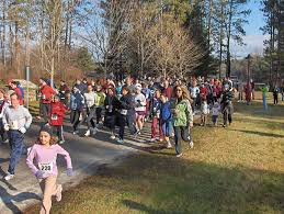 Runners are shown working off their yummy turkey dinners at Barringtons annual turkey trot run on Thanksgiving day.