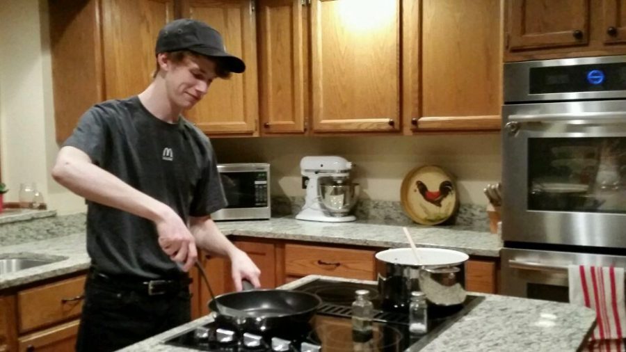 Brian Clancy is shown cooking in his kitchen, wearing his McDonalds uniform, remembering the good old days.
