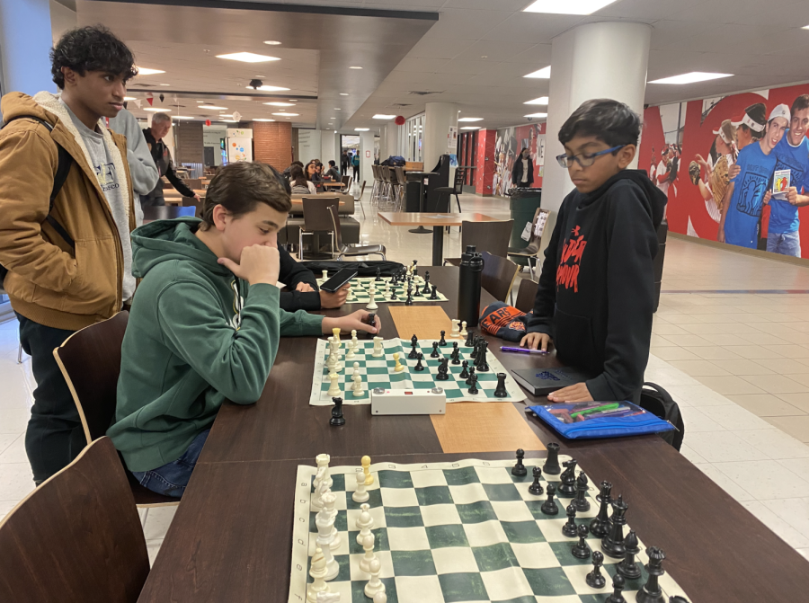 Chess club members playing match. Photo by Pow Silva 23.