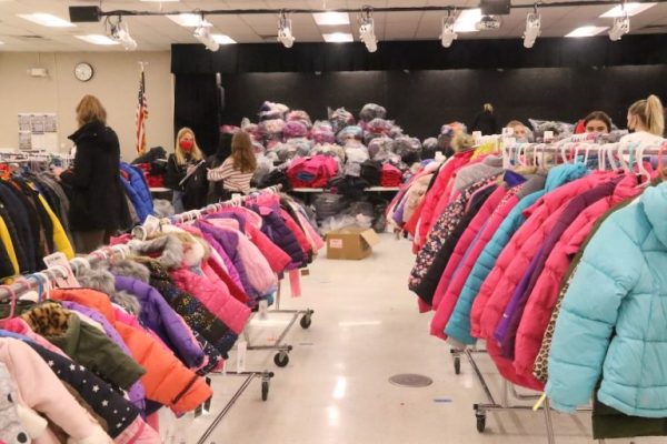 Rows of coats lined up for recipients of Barrington Giving Day to choose from. Photo by Bob Lee