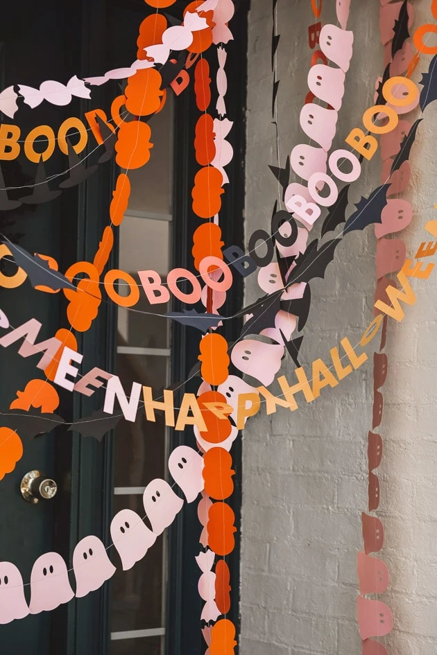 Photo of Autumn paper garland decor a door. 