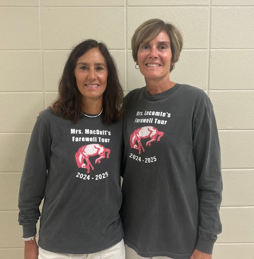 Math teachers Beth MacDuff (left) and Debbie LeComte (right) pose on the first day of their last school year together wearing matching shirts. Photo provided by Beth MacDuff. 

