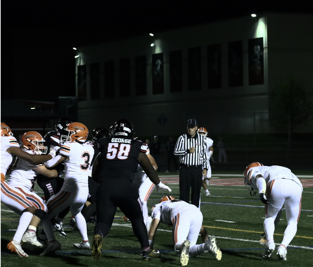 Malcolm George, 27', playing with his team during a season football game