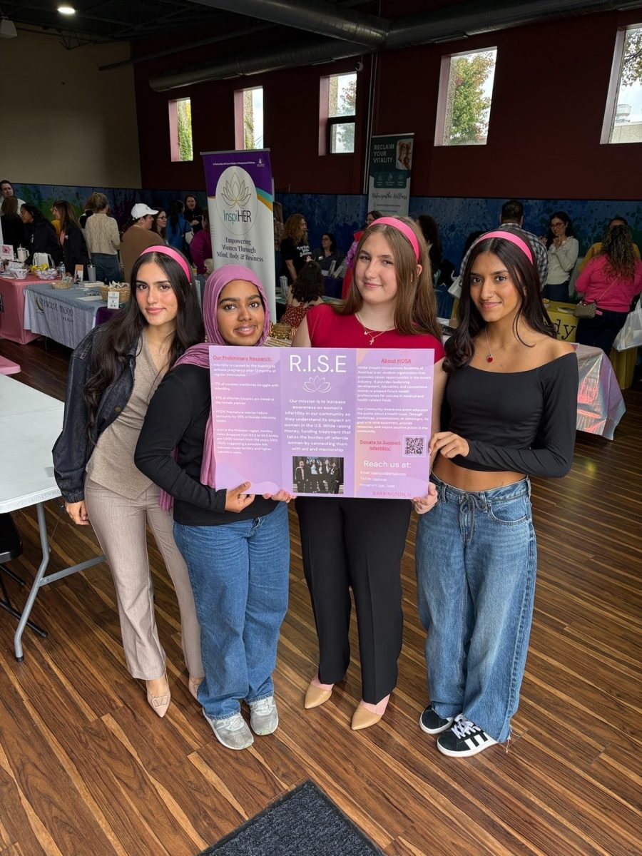 Juniors Ilhaam Naseeruddin, Inayah Mohammed, Abby Betz and Ashni Patel (left to right) spread awareness about RISE and their mission. RISE attended the Pineapple Squad Infertility Resource Fair, where they interacted with other infertility organizations and continued their goal of awareness and education. Photo courtesy of Inayah Mohammed, ‘27.