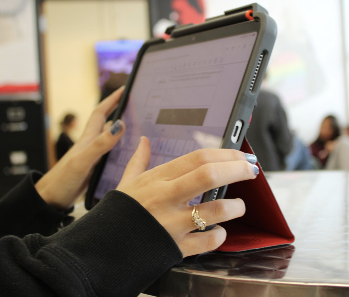 Student typing on their iPad. Students are given iPads as early as 1st Grade, and continue to use them throughout their D220 career. (Photo courtesy of Alana Zink ‘27)