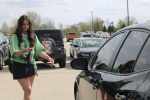 Senior Piper Novak ‘26 walks in the Hart Road Lot to get to her car. Photo illustration by Julia Bassali.