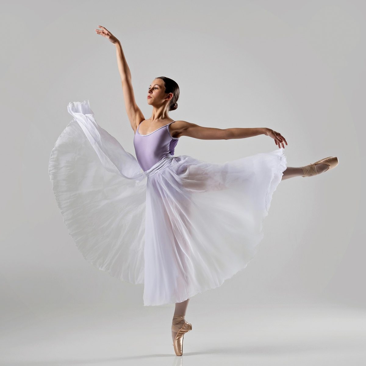 Myra Broderdorf, '28 performs an arabesque en pointe with her arms in first arabesque. Photo by Ron McKinney.